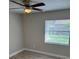 Comfortable bedroom with ceiling fan and bright window at 3187 Shady Willow Dr, Orlando, FL 32808