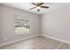 Bright room with natural light, a ceiling fan and wood look floors at 3187 Shady Willow Dr, Orlando, FL 32808