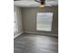 Cozy bedroom with a ceiling fan and ample natural light from a window at 3187 Shady Willow Dr, Orlando, FL 32808