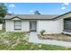 Welcoming entryway featuring a white privacy fence and modern front door, offering a serene entrance at 3187 Shady Willow Dr, Orlando, FL 32808