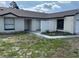 Single-story home exterior showcasing a well-maintained lawn and inviting entrance at 3187 Shady Willow Dr, Orlando, FL 32808