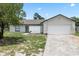 Charming single-story home with a spacious two-car garage and partially xeriscaped front yard at 3187 Shady Willow Dr, Orlando, FL 32808