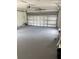 Spacious two-car garage with painted floor, work lighting, and an automatic door opener at 3187 Shady Willow Dr, Orlando, FL 32808