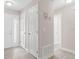 Bright hallway with multiple white doors and updated floors, providing access to rooms at 3187 Shady Willow Dr, Orlando, FL 32808