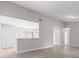 Bright and airy living space with open wall to the kitchen and updated floors, great for hosting at 3187 Shady Willow Dr, Orlando, FL 32808