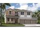 New two-story home with stone accents, a three-car garage, and well-maintained landscaping on a sunny day at 33313 Country House Dr, Sorrento, FL 32776