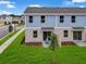 Aerial view of backyard patios with privacy fences and manicured lawns at 3345 Thicket St, Tavares, FL 32778
