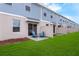 Backyard view featuring privacy fences, lawns, and outdoor patio at 3345 Thicket St, Tavares, FL 32778