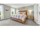 Beautiful bedroom featuring a large window, bedside tables and decor on the wall at 3345 Thicket St, Tavares, FL 32778