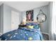 Cozy bedroom with space decor and an adjacent wall mirror at 3345 Thicket St, Tavares, FL 32778