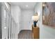 Inviting entryway with wood-look flooring and decoratively styled console table at 3345 Thicket St, Tavares, FL 32778