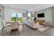 Cozy living room and dining area with modern furnishings and natural light at 3345 Thicket St, Tavares, FL 32778