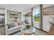 The airy living room offers a cozy sofa, a view of the dining area, and a backdrop of scenic outdoor views at 3345 Thicket St, Tavares, FL 32778