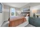 Neutral bedroom design, featuring a queen bed, stylish accents, and a bright window at 3348 Thicket St, Tavares, FL 32778