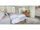 Spacious bedroom features gray carpet, a wooden dresser, a queen bed, and white accents at 3348 Thicket St, Tavares, FL 32778