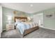 Relaxing bedroom features stylish wall decor, a comfortable bed, and ample natural light at 3348 Thicket St, Tavares, FL 32778