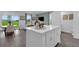 Open floor plan with kitchen, dining area, and living room with an island at 3348 Thicket St, Tavares, FL 32778
