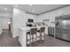 Bright kitchen with white cabinetry, stainless steel appliances, and an island with bar seating at 3348 Thicket St, Tavares, FL 32778