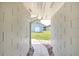 View of backyard from breezeway featuring a shed at 338 Eastern Ave, St Cloud, FL 34769