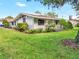 Charming house with lush lawn and mature trees at 338 Eastern Ave, St Cloud, FL 34769