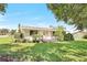 House with a well-manicured lawn and inviting front porch at 338 Eastern Ave, St Cloud, FL 34769