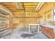 Interior of garage with wooden walls, shelves, and a wooden table at 338 Eastern Ave, St Cloud, FL 34769