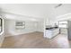 Open floorplan with modern white cabinets and black countertops flows into living area at 338 Eastern Ave, St Cloud, FL 34769