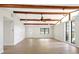 Spacious living room with exposed beams, natural light, and modern ceiling fan at 338 Eastern Ave, St Cloud, FL 34769