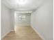 Finished room with wood-look floors and a window air conditioning unit at 338 Eastern Ave, St Cloud, FL 34769