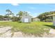 Shed with white double doors and green siding at 338 Eastern Ave, St Cloud, FL 34769