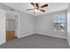Comfortable bedroom with carpet and a ceiling fan, featuring a bright window at 351 Lone Hill Dr # 206, Altamonte Springs, FL 32701