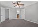 Carpeted bedroom with ceiling fan; ensuite bathroom and closet through adjacent doors at 351 Lone Hill Dr # 206, Altamonte Springs, FL 32701