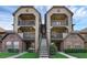 Condo exterior with two-story facade, balconies, and central staircase at 351 Lone Hill Dr # 206, Altamonte Springs, FL 32701