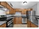 Modern kitchen with stainless steel appliances, stylish backsplash, and ample countertop space at 351 Lone Hill Dr # 206, Altamonte Springs, FL 32701