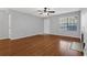 Bright living room featuring wood floors, a ceiling fan, and a fireplace at 351 Lone Hill Dr # 206, Altamonte Springs, FL 32701