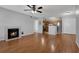 Open living area with fireplace, wood floors, and a view of the kitchen at 351 Lone Hill Dr # 206, Altamonte Springs, FL 32701