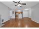 Open-concept living space with wood floors, kitchen view, and neutral decor at 351 Lone Hill Dr # 206, Altamonte Springs, FL 32701