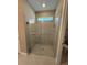 Modern bathroom featuring glass enclosed shower with tile surround and brushed nickel fixtures at 368 Birkdale Dr, Daytona Beach, FL 32124