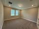 Spacious bedroom with plush carpeting, recessed lighting, and bright windows for natural light at 368 Birkdale Dr, Daytona Beach, FL 32124