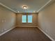 Bright bedroom featuring neutral walls, plush carpet, natural lighting, and ample space at 368 Birkdale Dr, Daytona Beach, FL 32124
