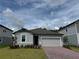 Charming single-Gathering home with a two-car garage, a well-manicured lawn and beautiful landscaping at 368 Birkdale Dr, Daytona Beach, FL 32124