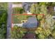 Aerial view of a single Gathering home with verdant landscaping and mature tree coverage at 39939 Parkinsonia St, Lady Lake, FL 32159
