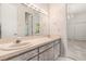 Bright bathroom featuring double sinks, vanity, and decorative wallpaper at 4026 S Lake Orlando Pkwy, Orlando, FL 32808