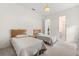Bedroom featuring twin beds, carpet floors, and an ensuite bathroom at 4026 S Lake Orlando Pkwy, Orlando, FL 32808