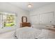 Cozy bedroom with twin beds, neutral decor, and a bright window view at 4026 S Lake Orlando Pkwy, Orlando, FL 32808