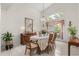 Dining room with a large window, chandelier, and ample seating at 4026 S Lake Orlando Pkwy, Orlando, FL 32808