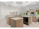 Open kitchen with an island, ample counter space, and neutral color palette at 4026 S Lake Orlando Pkwy, Orlando, FL 32808