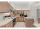 Functional kitchen with neutral countertops, plenty of cabinet space, and modern appliances at 4026 S Lake Orlando Pkwy, Orlando, FL 32808