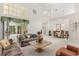 Airy living room featuring high ceilings, large windows, and access to the dining room at 4026 S Lake Orlando Pkwy, Orlando, FL 32808