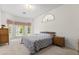 Bright main bedroom boasts large windows and a decorative accent window feature at 4026 S Lake Orlando Pkwy, Orlando, FL 32808